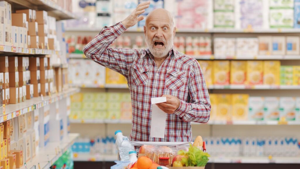 Angry customer checking an expensive grocery receipt