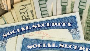 USA Social security cards laid on dollar bills