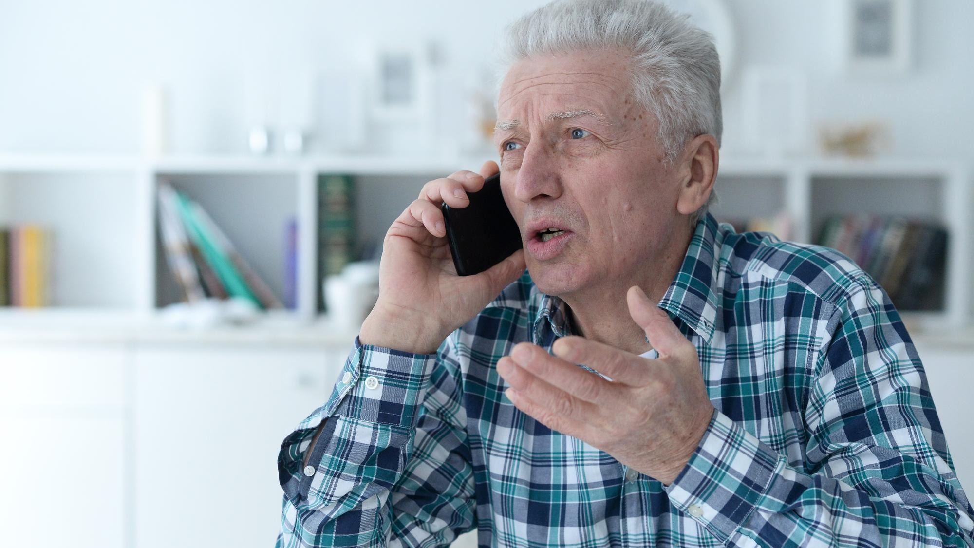 portrait of senior man talking on phone portrait of senior man talking on phone