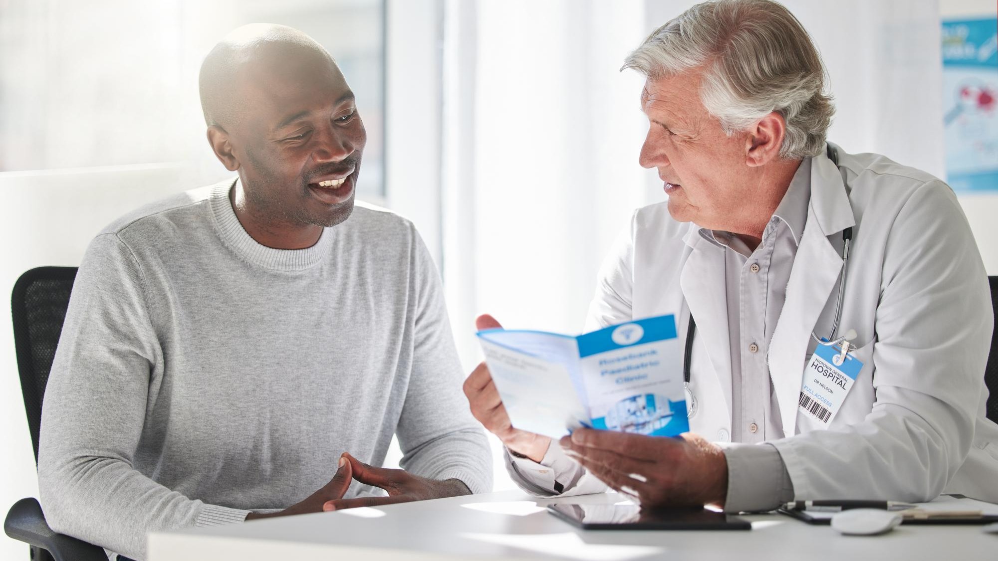 Brochure consulting and help with doctor and patient for medical life insurance or results Medicine healthcare and learning with men and pamphlet in hospital for support communication and advice Brochure consulting and help with doctor and patient for medical life insurance or results Medicine healthcare and learning with men and pamphlet in hospital for support communication and advice
