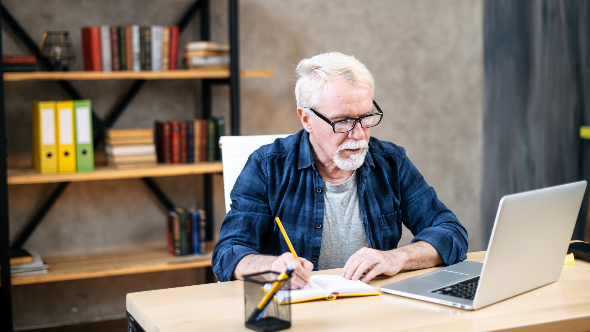 Older man using laptop for studying working Older man using laptop for studying working