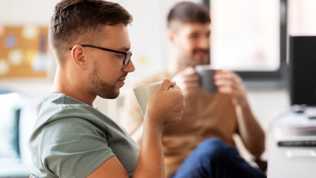 men or startuppers drinking coffee at office