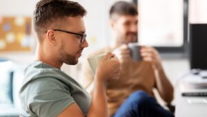 men or startuppers drinking coffee at office