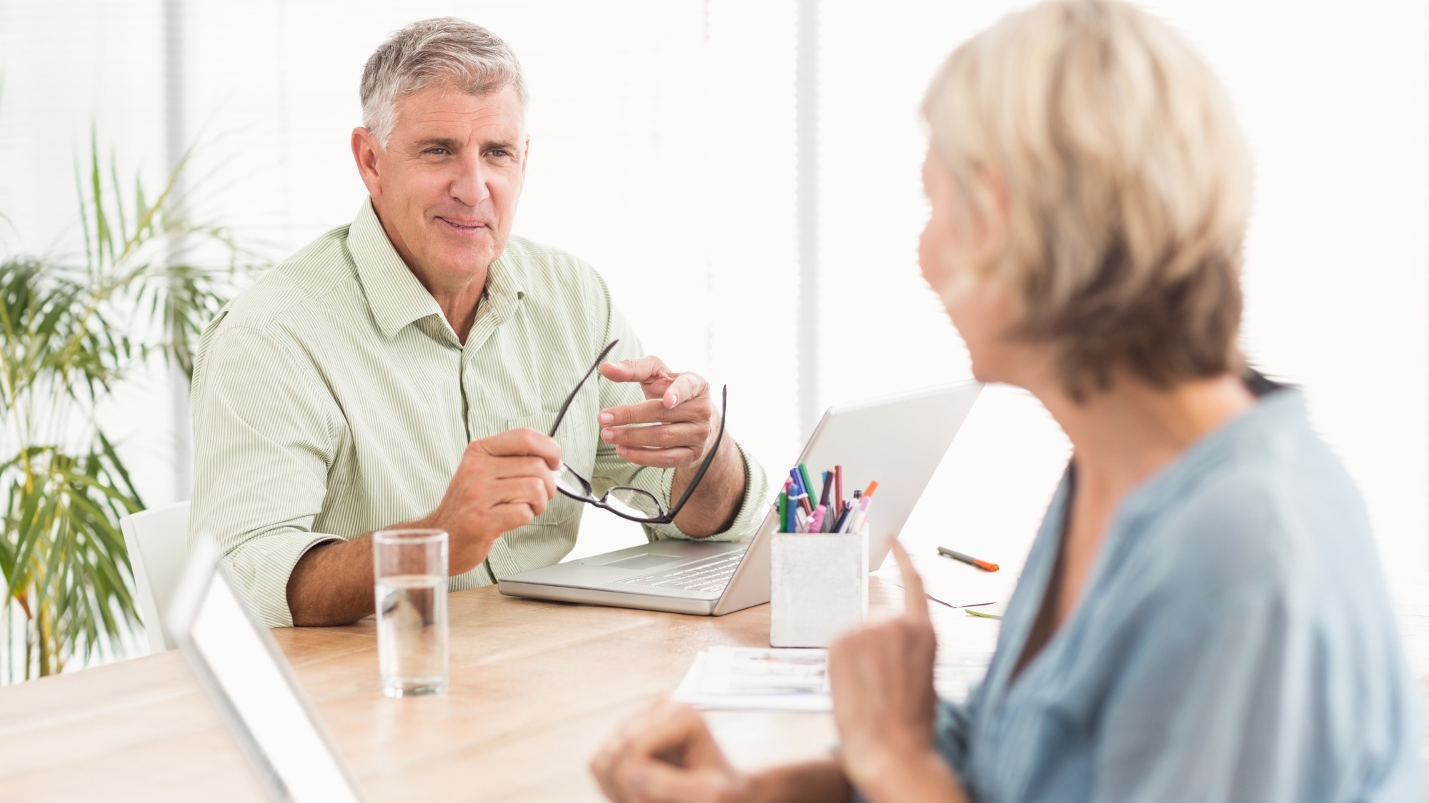 Casual business team discussing together Casual business team discussing together