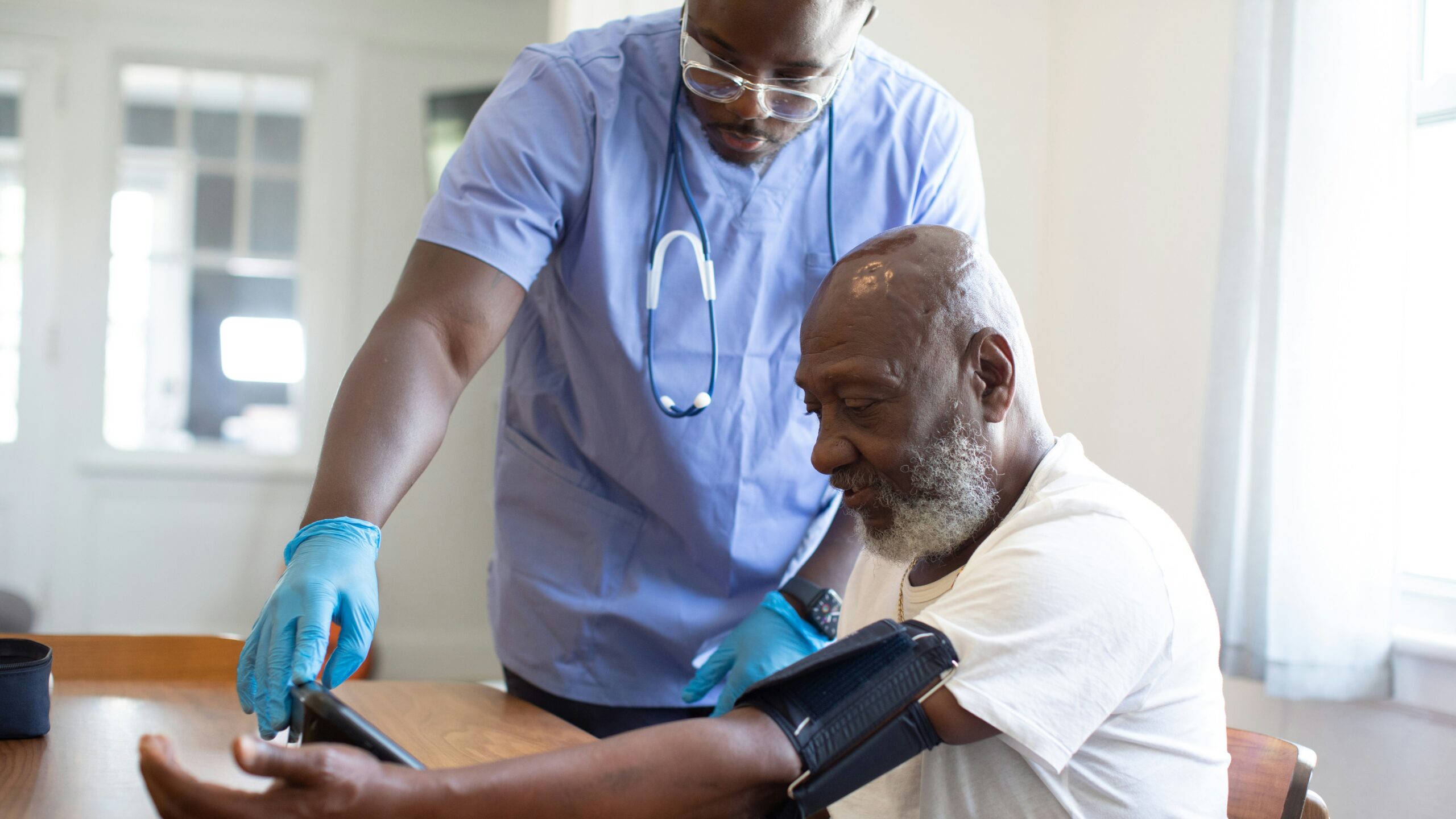 a man showing a man something on the tablet a man showing a man something on the tablet